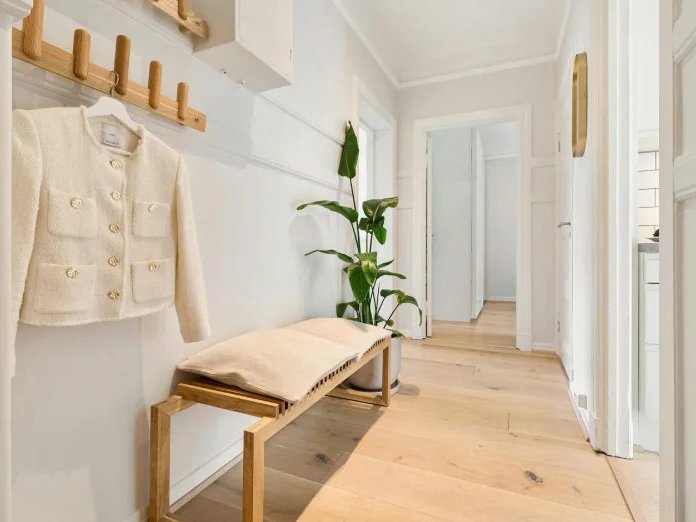 Stylish home with wood flooring in a bright hallway